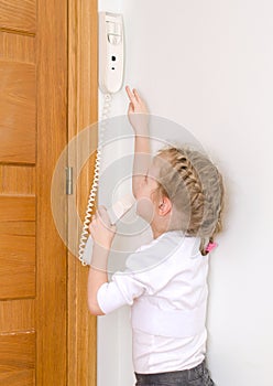 Little girl talking on the intercom
