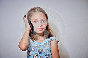 a little girl talking on a mobile phone, small children and technology