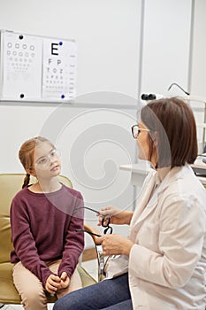 Little Girl Talking to Female Doctor