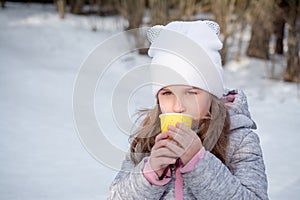 Little girl with tea cup