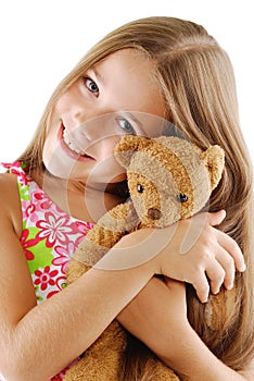 Little girl with teddy bear on white