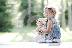 Little girl with Teddy bear