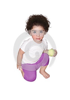 Little girl with a tennis ball