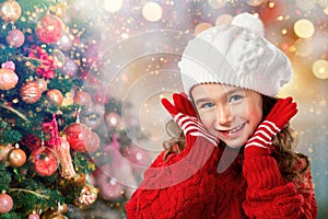 Little girl think about Santa near Christmas tree