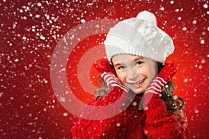 Little girl think about Santa on red background. Christmas sale
