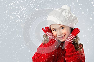 Little girl think about Santa on snow background