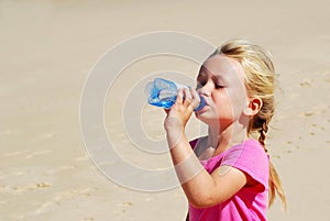 Little girl thirsty photo