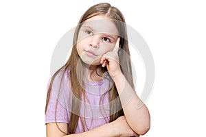 The little girl thought and put her hand under her head. Isolated on a white background.