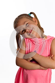 Little girl tilting her head and smiling