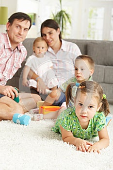 Little girl together with family at home