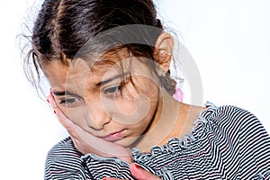 Little girl with toothache in white background