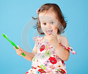 A little girl with a toothbrush