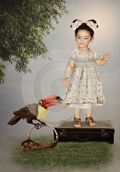 Little girl and Toucan