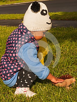 Little girl touches mushroom