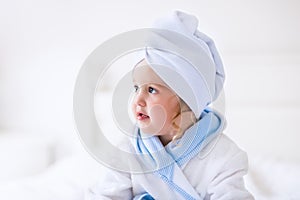 Little girl in a towel after bath