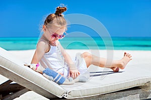 Little girl with toy at beach
