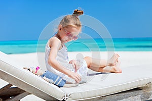 Little girl with toy at beach