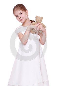 Little girl with toy bear