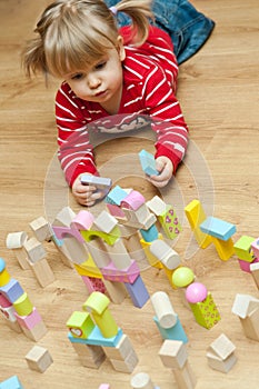 Little girl with toy blocks