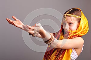 Little girl in traditional Indian clothing and jeweleries