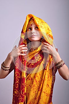 Little girl in traditional Indian clothing and jeweleries