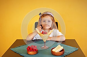 A little girl with traditional Italian dessert zabaione.