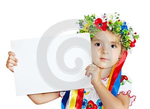 Little girl in traditional ukrainian costume clothes holding pap