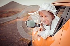 Little girl traveling by car