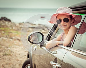 Little girl traveling by car