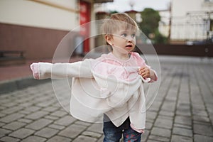 Little girl tried to get dressed wrong way photo