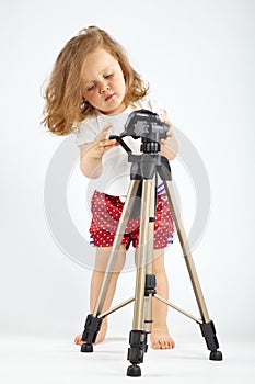 Little girl with tripod