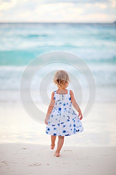 Little girl on tropical beach