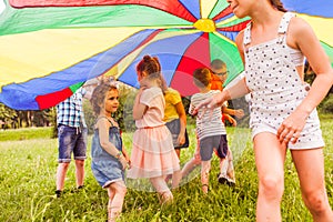 Little girl trying to join active game of older kids