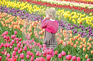 Little girl in tulip field