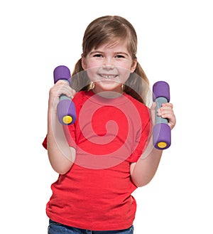 Little girl with two dumbbells