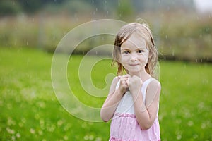 Little girl under the rain