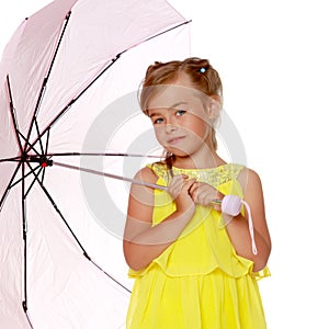 Little girl under an umbrella.