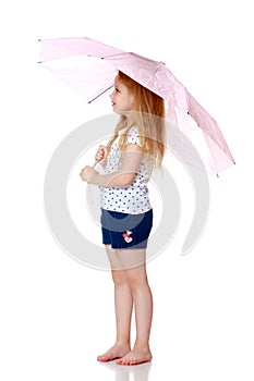 Little girl under an umbrella.