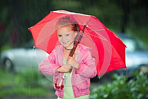 Little girl under an umbrella