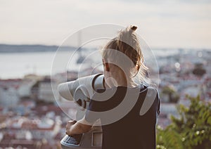 Little girl using telescope.