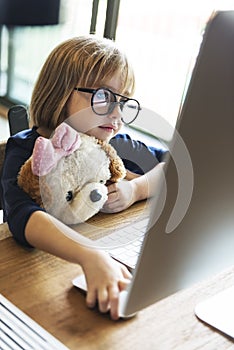 Little Girl Using Computer Concept