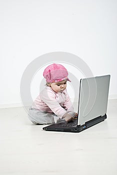 Little girl using laptop