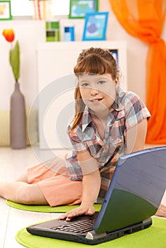 Little girl using laptop