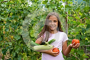 Little girl in vegetable garden