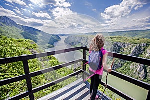 Little girl at viewpoint, beautiful nature landscape, amazing view on gorge Danube river