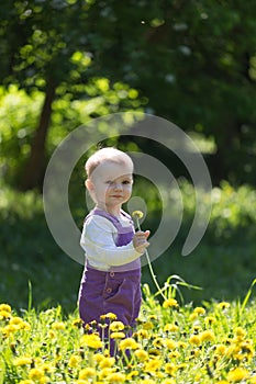 Little girl in violet overalls