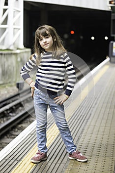 Little girl waiting the train