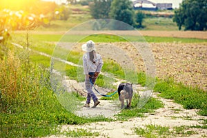 Little girl walk with dog