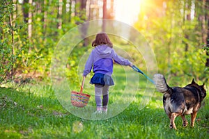 Little girl walking with dog