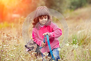 Little girl walking with dog